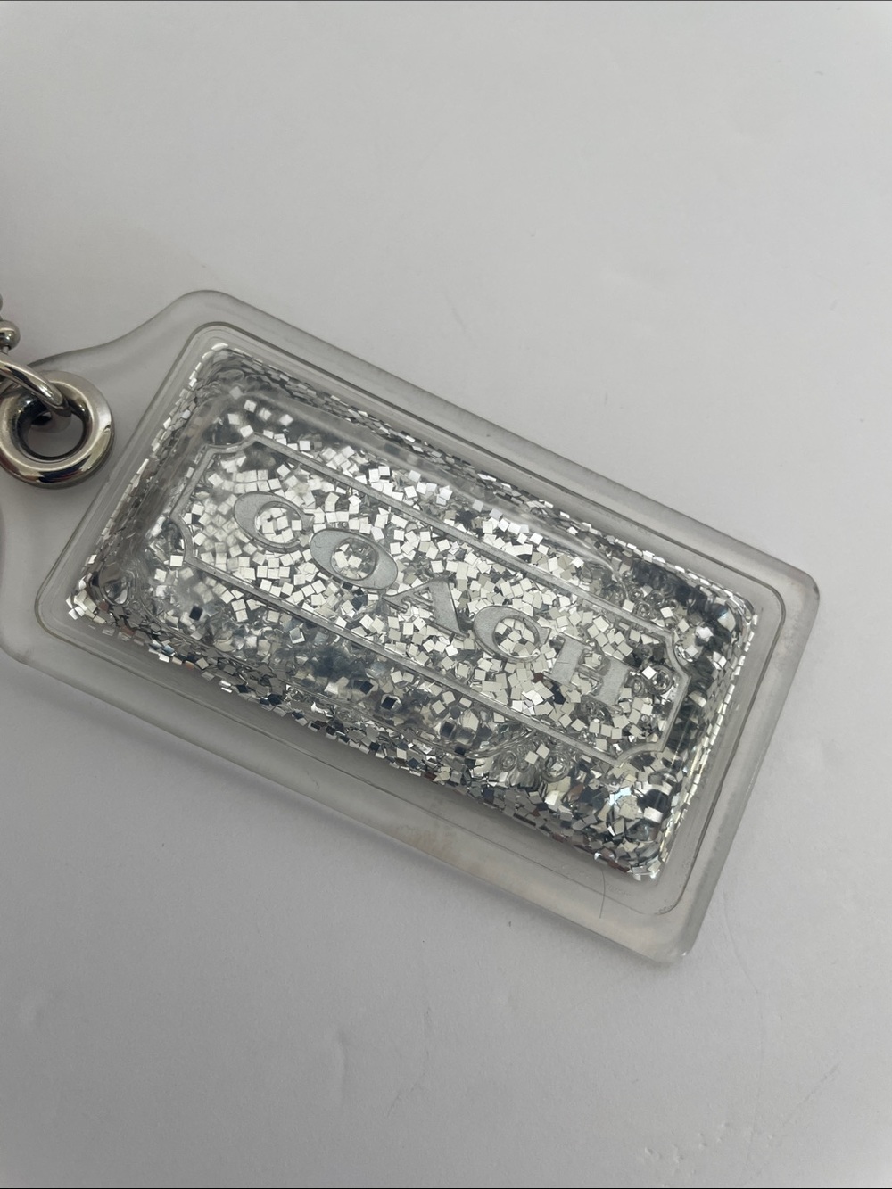 Coach Liquid Glitter Acrylic Hang Tag Clear | Silver